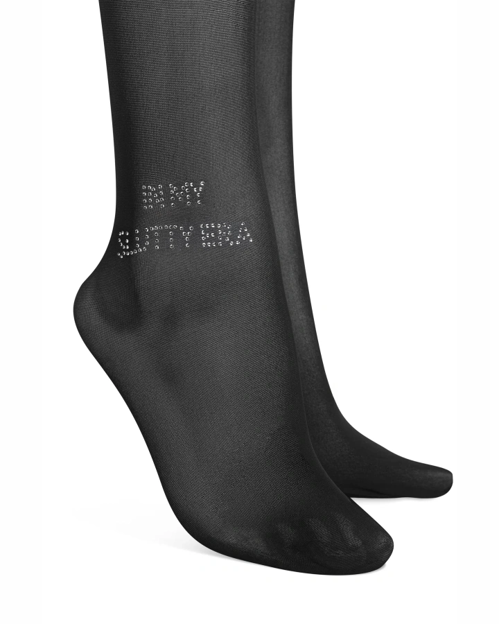 Otwarte rajstopy z napisem "IN MY SLUTTY ERA"